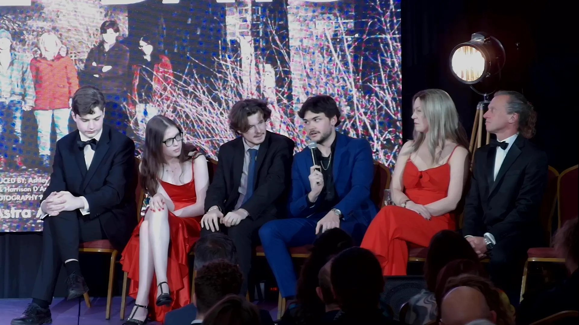 Cast and filmmakers appearing on stage